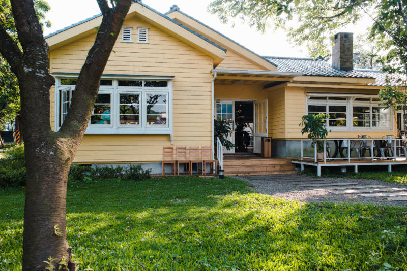 Charming yellow house with wooden windows